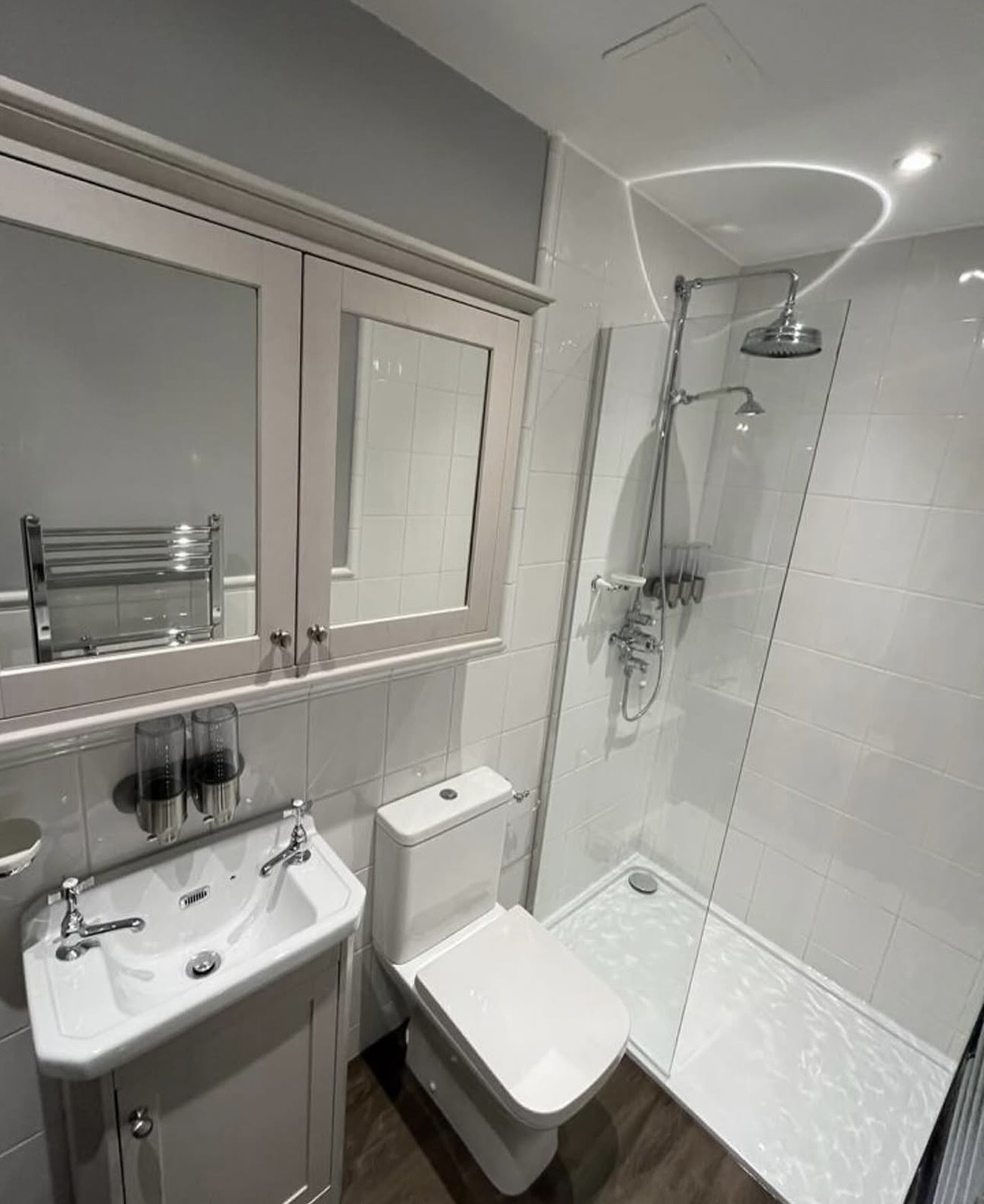 Luxury wet room with twin shower heads installed by M3 Trades